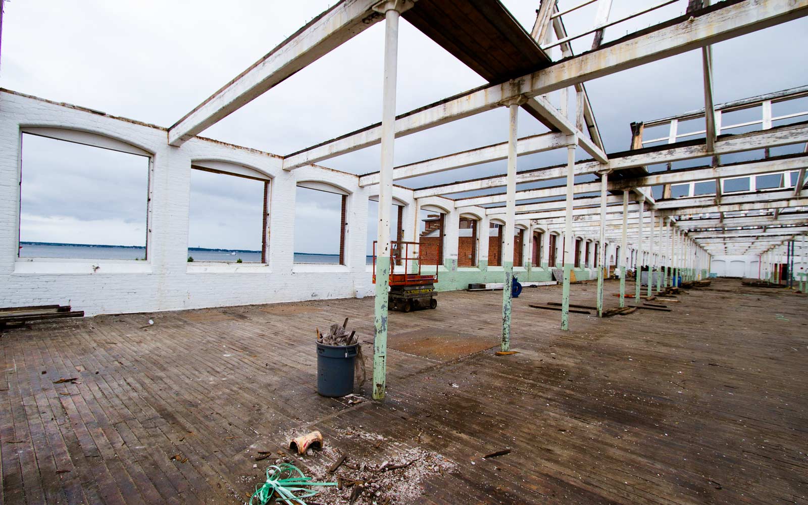 The mill building roof and windows have been removed. On your left side of the photo you can see the New Bedford harbor through the windowless brick frame.