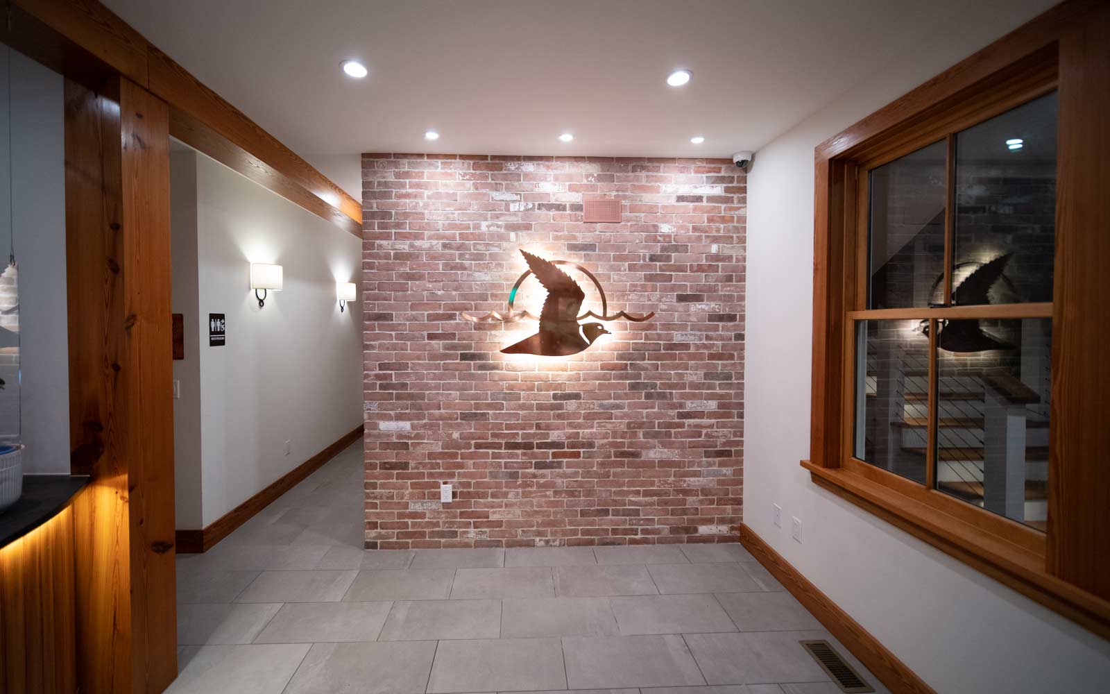 Reclaimed Brick Tile Wall Inside Interior of Retail Store Lobby