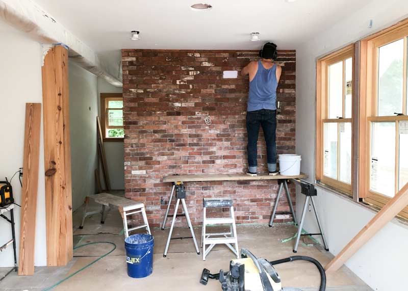 Reclaimed Brick Tile Wall under construction by Artisan Dustin Brunelle by Outermost Tile of Cape Cod